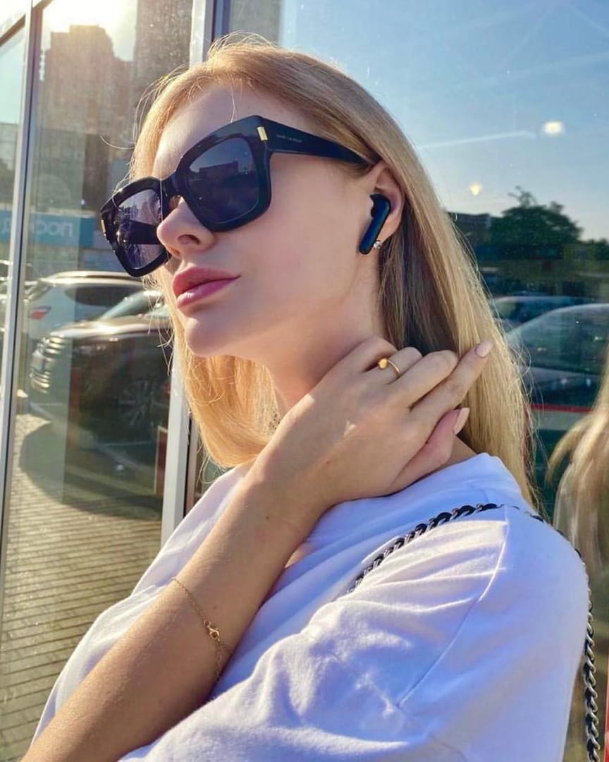 image of customer using YAJ Earbuds